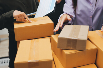 Portrait of Starting small businesses SME owners, two Asian woman check online orders Selling...