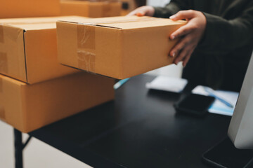 Portrait of Starting small businesses SME owners, two Asian woman check online orders Selling...