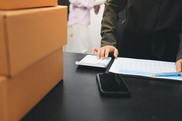 Portrait of Starting small businesses SME owners, two Asian woman check online orders Selling...