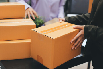 Portrait of Starting small businesses SME owners, two Asian woman check online orders Selling...