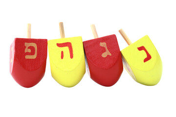 Colorful Hanukkah dreidels isolated on white. The dreidels are ordered: Nun, Gimel, He, Pe (Nes Gadol Haya Po)
