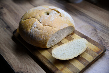 Assortment of baked bread on wooden table
