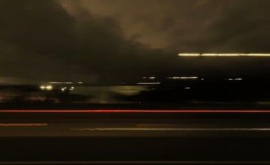 Selective focus photography. A frame in motion. Abstract background. Colorful image. Long shutter speed. Light streaks. Movement of transportation. Shooting from transportation. Blurred image