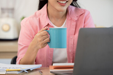 Work from Home Woman Enjoying Coffee While Working on Laptop