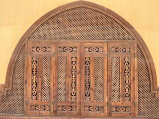 Beautiful unusual wooden window with shutters on the wall of the house El Gouna, Hurghada, Red Sea,...