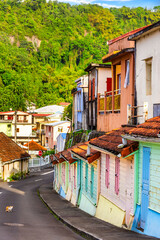 Colorful houses in Grande Riviere, Martinique, France, along General Charles de Gaulle Avenue. Grand Riviere the northernmost town of the Caribbean island of Martinique.