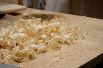Wood shavings and sawdust on carpentry workbench
