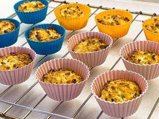 Freshly baked coconut muffins cooling on a wire rack