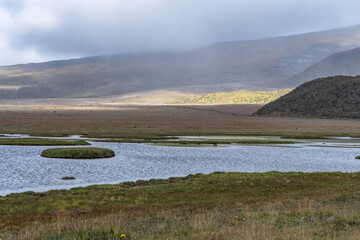 View of snow-capped Cotopaxi from the moors of the national park, showcasing the beauty of its...