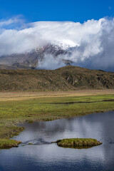View of snow-capped Cotopaxi from the moors of the national park, showcasing the beauty of its...