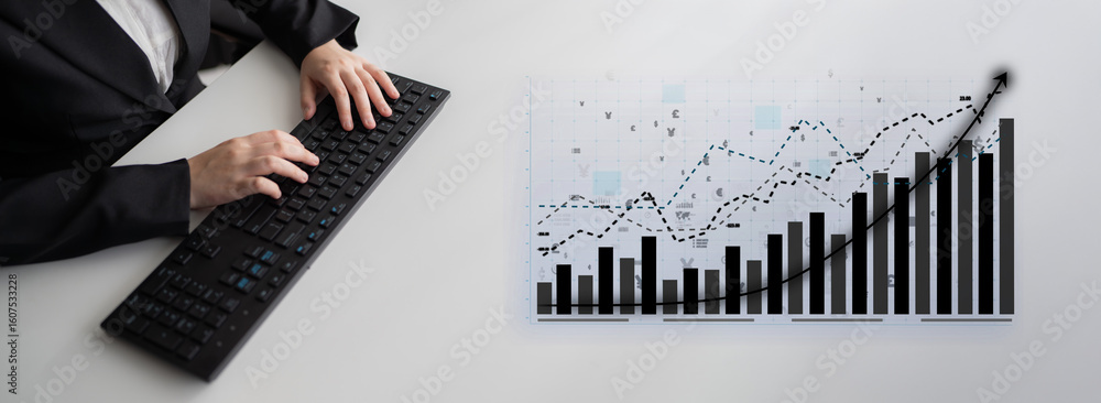 Poster a business professional is focusing on financial data analysis at a modern workspace, using a keyboa