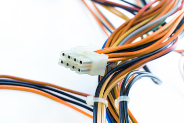 red and black wire tangled with white connector on isolated background