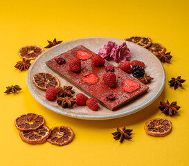 Bar sweet craft artisan chocolate with dried fruits made at home. Craft chocolate