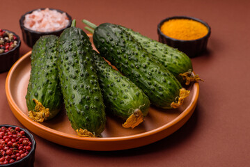 Fresh raw whole cucumbers, an ingredient for preparing salads and vegetarian dishes. Green fresh...