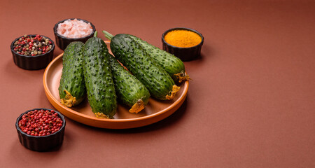 Fresh raw whole cucumbers, an ingredient for preparing salads and vegetarian dishes. Green fresh...