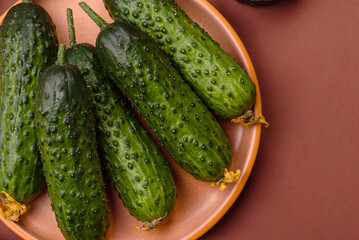 Fresh raw whole cucumbers, an ingredient for preparing salads and vegetarian dishes. Green fresh...