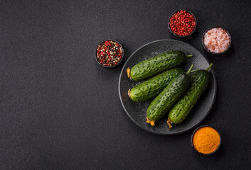 Fresh raw whole cucumbers, an ingredient for preparing salads and vegetarian dishes. Green fresh...
