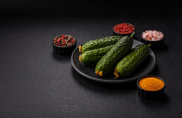 Fresh raw whole cucumbers, an ingredient for preparing salads and vegetarian dishes. Green fresh...