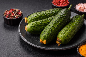 Fresh raw whole cucumbers, an ingredient for preparing salads and vegetarian dishes. Green fresh...