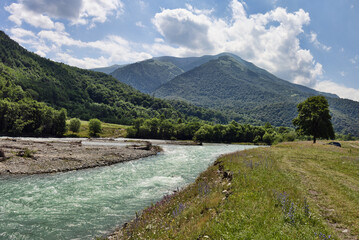 Bolshoy Zelenchuk river in Caucasus mountains under blue sky
