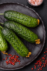 Fresh raw whole cucumbers, an ingredient for preparing salads and vegetarian dishes. Green fresh cucumbers