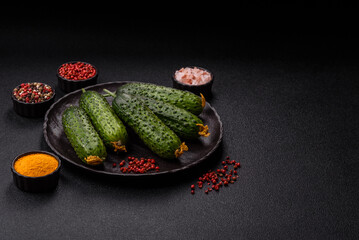 Fresh raw whole cucumbers, an ingredient for preparing salads and vegetarian dishes. Green fresh...