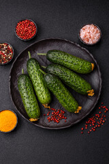 Fresh raw whole cucumbers, an ingredient for preparing salads and vegetarian dishes. Green fresh cucumbers