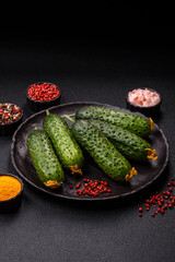 Fresh raw whole cucumbers, an ingredient for preparing salads and vegetarian dishes. Green fresh cucumbers