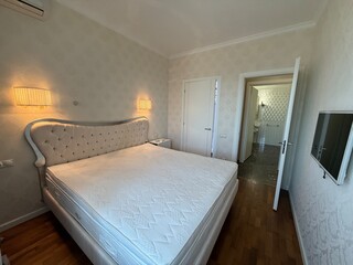 Elegant Bedroom with Tufted Headboard and Classic Interior Design