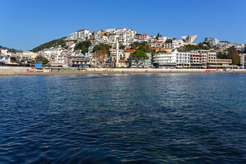 Ulcinj waterfront skyline with mosque, beach and Adriatic Sea under clear blue sky, Montenegro