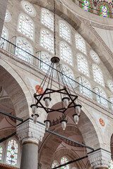 Traditional hanging chandelier and stained glass windows inside Mihrimah Sultan Mosque, Istanbul,...