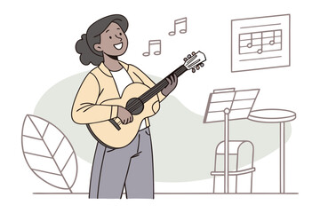 Joyful young woman with dark curly hair happily singing while playing acoustic guitar with sheet music nearby