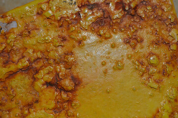 Close-up of weathered metal surface showing natural rust patterns and oxidation textures.