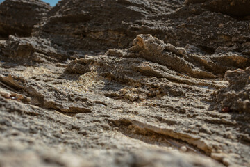 Multiple layers of weathered limestone creating natural geological patterns along Mediterranean coastline