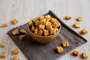 Homemade Crispy Bread Croutons in a Bowl, side view.