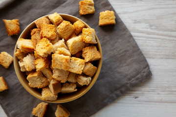 Homemade Crispy Bread Croutons in a Bowl, top view. Close-up.