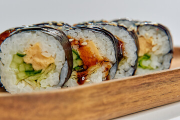A Delicious Serving of Sushi Rolls with Fresh Ingredients and Aesthetic Appeal Presented on a...