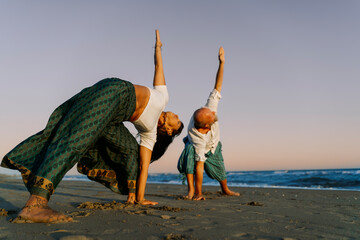 Partner Yoga Practice on Ocean Shore