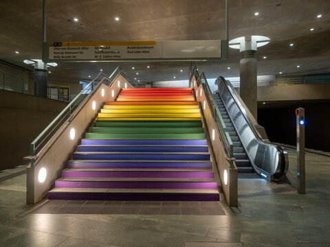 Berlin, Germany - July 25, 2025: Bundestag BVG metro station stairs are painted in rainbow colors resembling LGBTQ pride flag