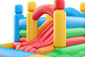 Vibrant inflatable playground section.  Colorful bouncy castle features castle-like structures, a slide, and various play areas