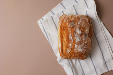 Beautiful and delicious artisan bread on a light background, top view