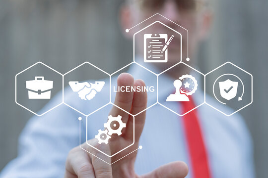 Business person using virtual touch screen push text: LICENSING. License agreement business technology concept. Copyright protection law license property rights.