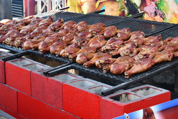 Many turkey legs being grilled at Frontier Days, Cheyenne WY.