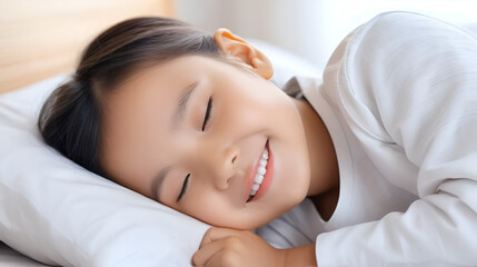 Happy smile child sleep with good dream in bed,