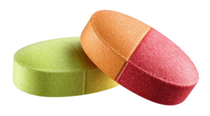 Two colorful, oval-shaped pills, one light orange/peach, the other light green/yellow, layered, with a visible reddish-pink division, rest on a black background.  They appear to be coated and textured