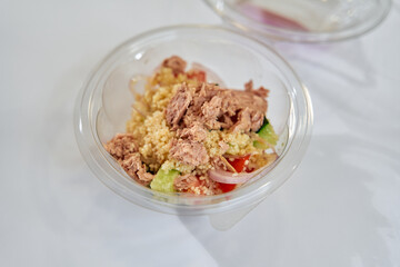 A Fresh and Flavorful Salad Bowl Featuring Tasty Tuna, Nutritious Vegetables, and Savory Couscous for a Healthy Meal Option
