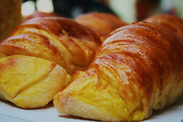 Two Croissants: Golden Morning Delight
Two perfectly baked croissants rest side by side. The rich, buttery aroma seems almost tangible, inviting you to savor a moment of simple indulgence.