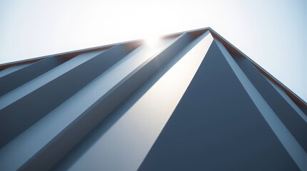 A modern office building facade with abstract triangular windows reflects the blue sky and clouds