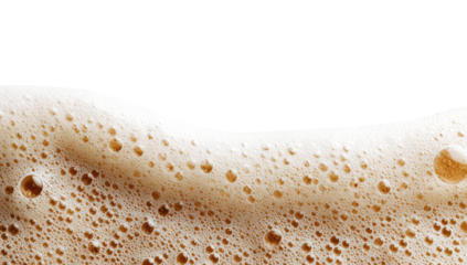 Close-up of frothy, light-tan foam