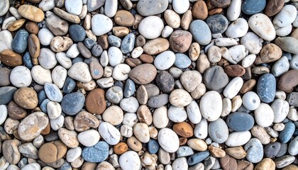 Naklejka premium Close-up view of a textured surface of varied smooth stones